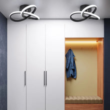 A pair of black LED ceiling lamps installed in a modern dressing room, providing bright and efficient lighting.