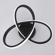 Top-down view of the APTEL black LED ceiling lamp, featuring two intertwined LED loops for modern interior lighting.