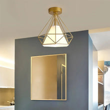Single gold Robin ceiling light above hallway mirror.