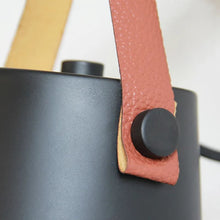 Close-up of the premium faux leather strap on the Celora Wooden Wall Light