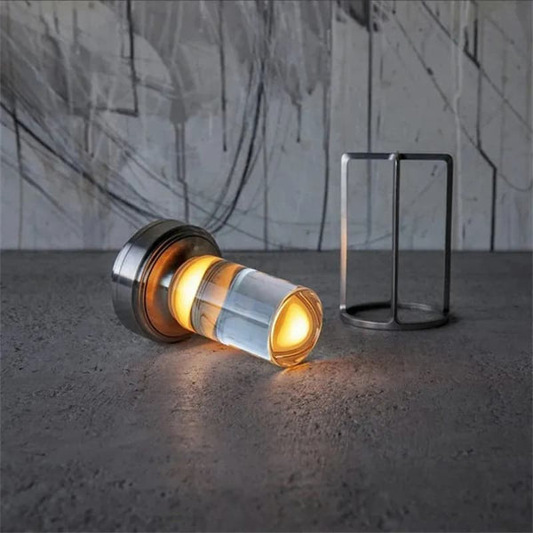 Industrial-style rechargeable Crystal Lantern Lamp placed on a textured surface.