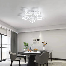 FLORA LED ceiling light enhancing a modern dining room with its elegant petal-shaped design.