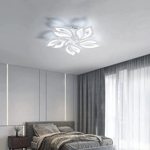 FLORA LED ceiling light installed in a minimalist bedroom, complementing a sophisticated interior style.