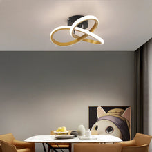 Elegant gold LED ceiling lamp, perfect for contemporary dining rooms, providing warm neutral white lighting.