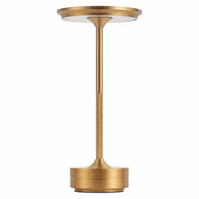 A gold Metal Glow Lamp with a textured grip and soft light glow.