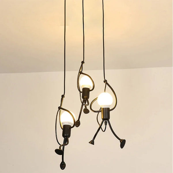 Close-up of three Iron Little Man Ceiling Lamps with a minimalist black metal design, ideal for modern interiors.