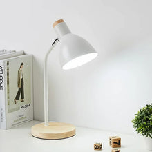 Scandinavian-style white Lesko Desk Lamp with a smooth metal shade and sturdy wooden foundation.