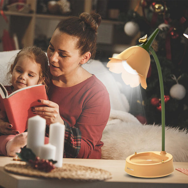 A mother reading to her child with the warm light of the LumiBloom Table Lamp, ideal for bedtime reading.