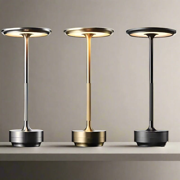 Three Metal Glow Lamps in silver, gold, and black, displayed on a neutral background.