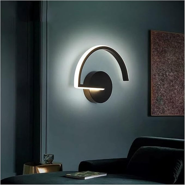 Close-up of black arc LED wall light with soft backlighting