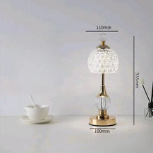 Modern vintage crystal table lamp with dimmable LED light and durable electroplated gold body.