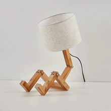 WoodFlex Table Lamp with a beige fabric lampshade, featuring an adjustable wooden body and a modern minimalist design.