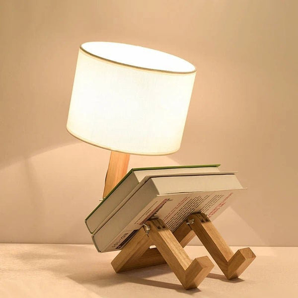 A unique wooden table lamp with a flexible, adjustable design and a linen lampshade.