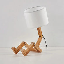 WoodFlex Table Lamp with a white fabric lampshade, featuring an adjustable wooden body and a modern minimalist design.